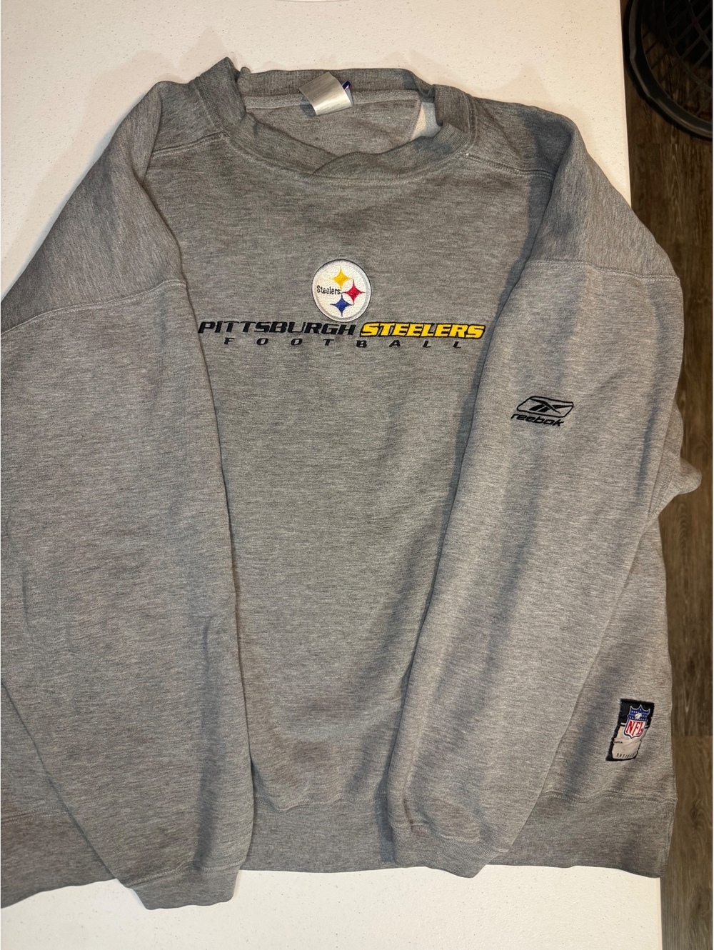 Pittsburgh Steelers crewneck (has some wear and a small spot on arm)